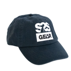 A dark navy blue cotton baseball cap with a white embroidered logo on the front that reads 'S2S GEAR' with a silhouette figure, shown against a plain white background.
